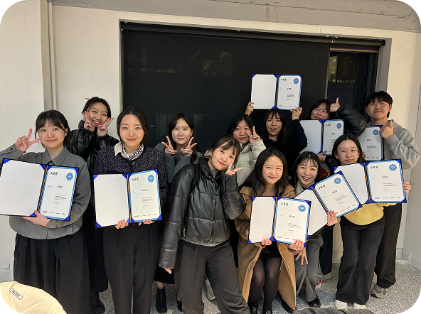 The intern cohort holding their certificates after the final presentation.